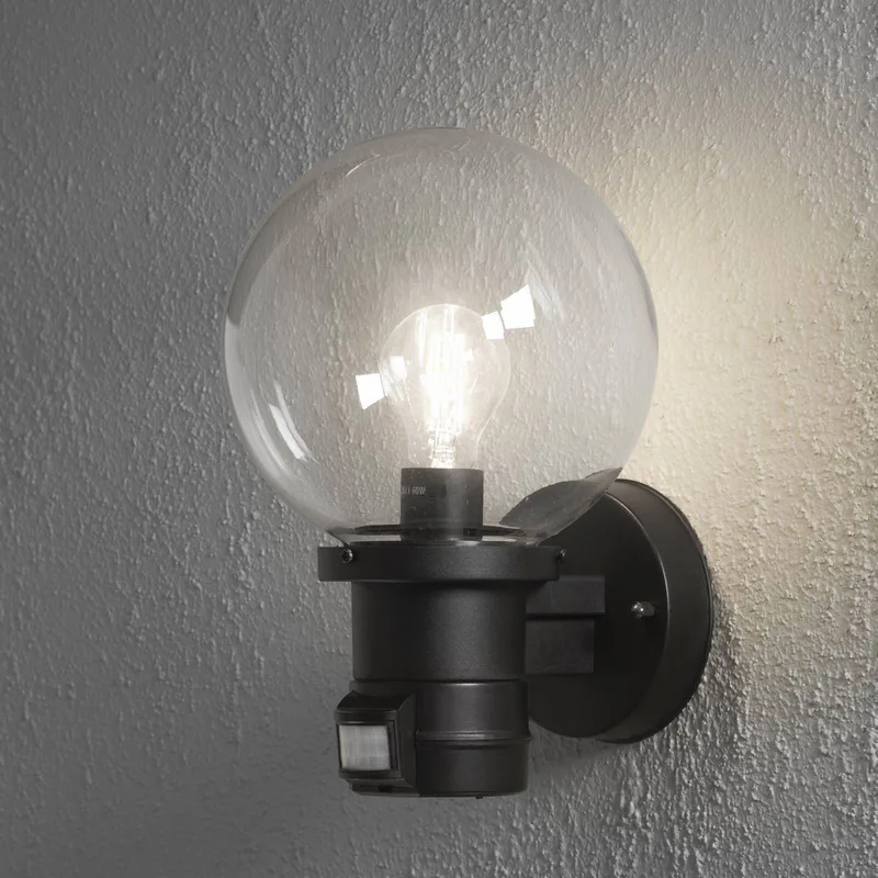 Nemi buitenwandlamp met bewegingsmelder, zwart från Konstsmide i Svart, Helder – produktbild