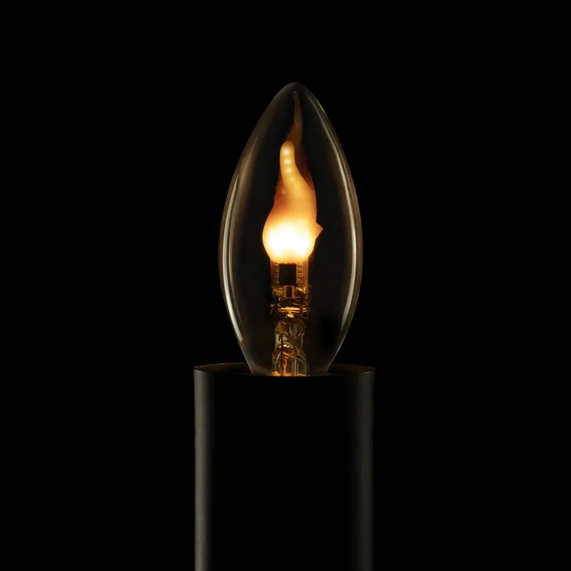 LED-kaarslamp Fire Flame Line E27, 0,2 W, rookgrijs, 1.800 K fra Segula i Rookgrijs, Guld – produktbillede